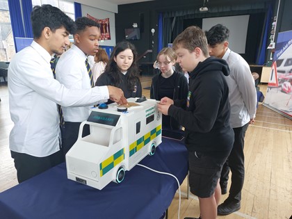 Kids inspect an ambulance model at Shawlands Academy
